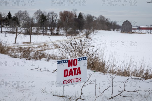 Saline, Michigan USA - 1 December 2025 - A sign on a rural Michigan road opposes a planned $7 billion data center on southeast Michigan farm land. Opponents say the Data Center could raise residential electricity rates and endanger the water supply