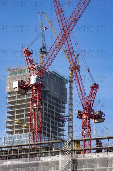 Construction site of the Covivio skyscraper in front, in the vicinity of Alexanderplatz in Berlin, mixed use of apartment, offices, retail and a daycare center, the high-rise construction site of The Berlinian office high-rise building in the back, Germany