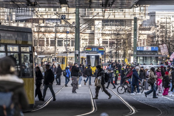Trams at Alexanderplatz in Berlin, passers-by, Germany