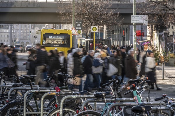 Passers-by on a Grunerstraße pedestrian crossing near Alexander Platz, bicycle parking lot in Berlin, Germany