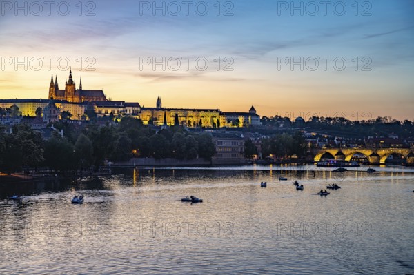 Sunset over the Vltava River, Charles Bridge and Prague Castle in Prague, Czech Republic