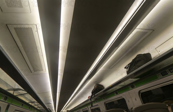 Pattern formed by stripes of ceiling lighting inside GWR InterCity Express train carriage, UK