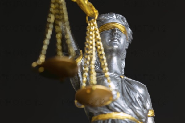 Close-up of justice as a symbol of court rulings, case law, justice, etc