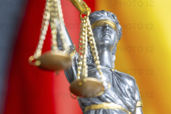 Close-up of justice in front of the flag of Germany (symbolic image)