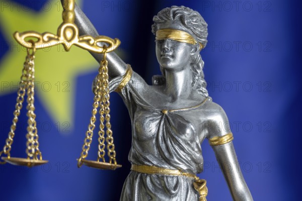 Close-up of justice in front of the flag of the European Union (symbolic image)