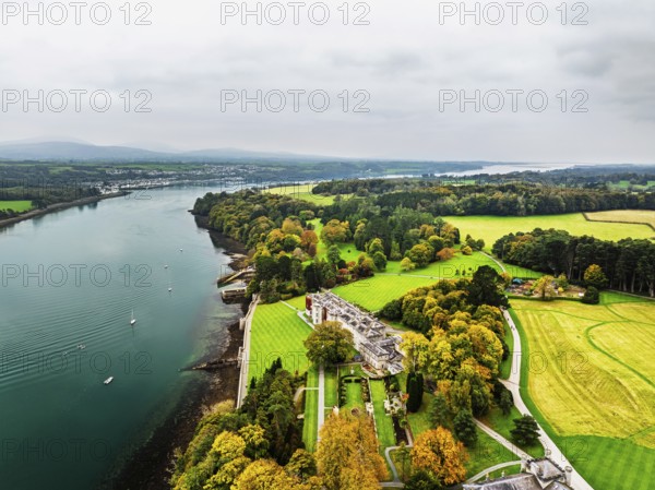 Autumn over Plas Newydd House from a drone, Gardens and Parkland, Llanfairpwllgwyngyll, Anglesey, Wales, UK
