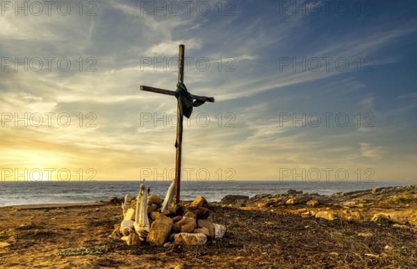 Religious scene, temporary Christian cross on the coast Farol de Cabo Raso lighthouse, São Bras de Sanxete fortress, Cascais, Portugal