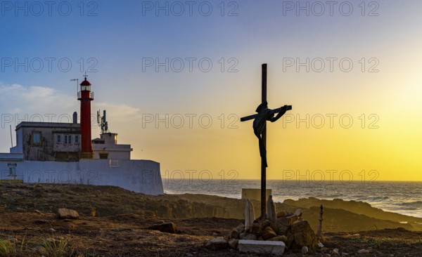 Religious scene, temporary Christian cross on the coast, Farol de Cabo Raso lighthouse, Sao Bras de Sanxete fortress, Cascais, PortugalFarol de Cabo Raso lighthouse, Sao Bras de Sanxete fortress, Cascais, Portugal