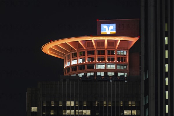 On the occasion of Orange Day, the international day against violence against woman on 25.11.2025, numerous buildings on the banking skyline in Frankfurt am Main were illuminated in orange, including the DZ Bank Tower, Frankfurt am Main, Hesse, Germany Germany
