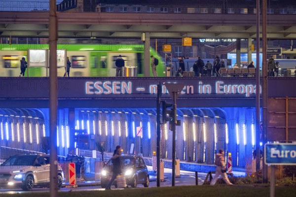 The main train station in Essen, blue-lit underpass, bus station, am Europaplatz, public transport train on the platform, North Rhine-Westphalia, Germany