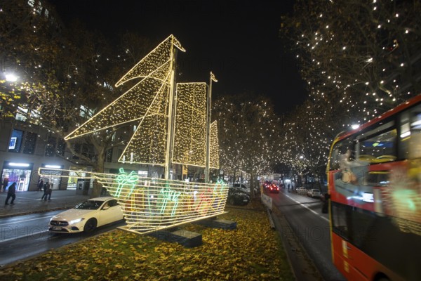 The Kurfürstendamm in western Berlin with Christmas lights and several light installations, such as this ship, on 25.11.2025. The magnificent boulevard is illuminated with 150, 000 lights between Breitscheidplatz and Halensee