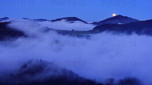 View from the Gisliflue of the Jurassic foothills covered in fog from the left, Wasserfluh, Summerholde, Asperstrihen, Strihen, in the light of a full moon, Talheim, Canton, Aargau, Switzerland