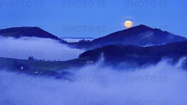 View from the Gisliflue of the Jurassic foothills covered in fog from the left, Asperstrihen, Strihen, in the light of the full moon, Talheim, Canton, Aargau, Switzerland