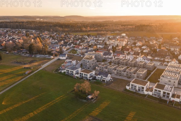 Residential area with fields photographed from the air at sunset, peaceful atmosphere, Althengstett, Calw district, Germany