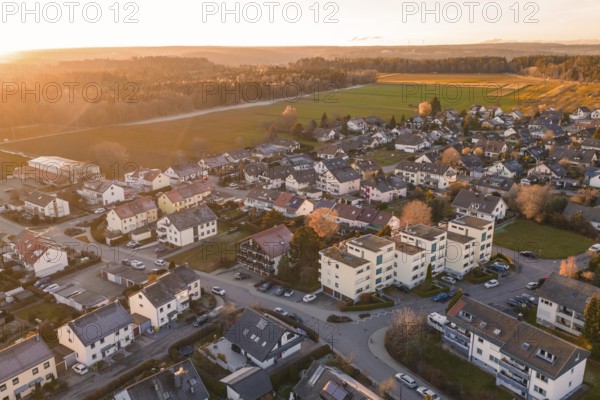 Aerial village with settlements and fields in evening autumn light, Althengstett, Calw district, Germany