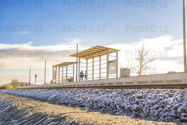 Station platform under blue sky in rural surroundings, new Hermann Hessebahn railway station, Ostelsheim, Calw district, Germany