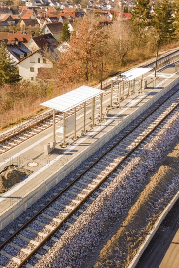 Detailed view of the covered platform of a small train station with tracks, new Hermann Hessebahn station, Ostelsheim, Calw district, Germany