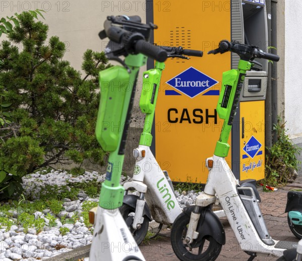 Electric scooters and rental bikes on public roads, Berlin, Germany