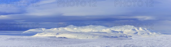 Snow covered mountains in Arctic landscape at Mohnbukta, bay at the western shore of Storfjorden in Sabine Land at Spitsbergen, Svalbard