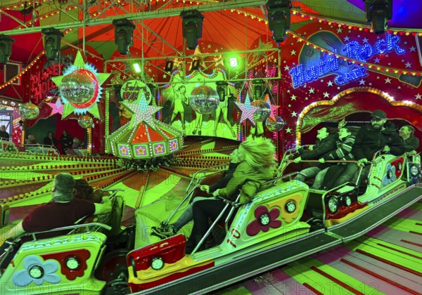 People on the Musik-Express ride at the All Saints Fair, the biggest old town fair in Europe, Soest, North Rhine-Westphalia, Germany