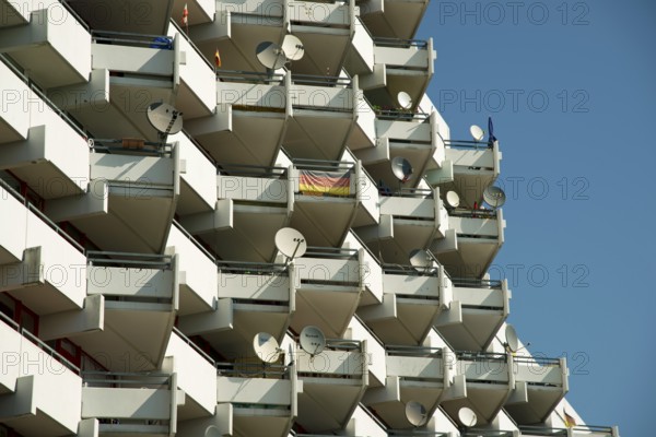 High-rise apartment building with balconies and satellite dishes, satellite town of Chorweiler in Cologne, North Rhine-Westphalia, Germany