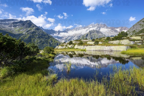 Picturesque mountain landscape, dammastock and damma glaciers reflected in Moorsee, Göscheneralp, Canton of Uri, Switzerland