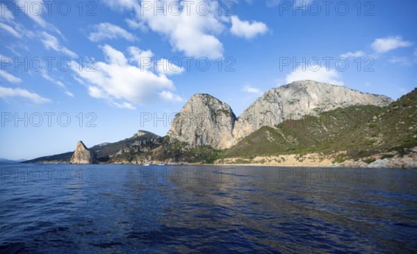 Picturesque rocky coast, cliffs with Pedra Longa pinnacle, blue sea, Golfo di Orosei, Baunei, Sardinia, Italy