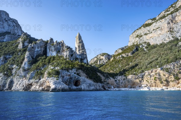 Picturesque rocky coast, cliffs with L'Aguglia pinnacle, blue sea and Cala Goloritzé beach, Golfo di Orosei, Baunei, Sardinia, Italy
