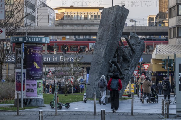 Downtown Essen, passers-by at Europaplatz, main train station, mining monument Steile Lagerung, North Rhine-Westphalia, Germany