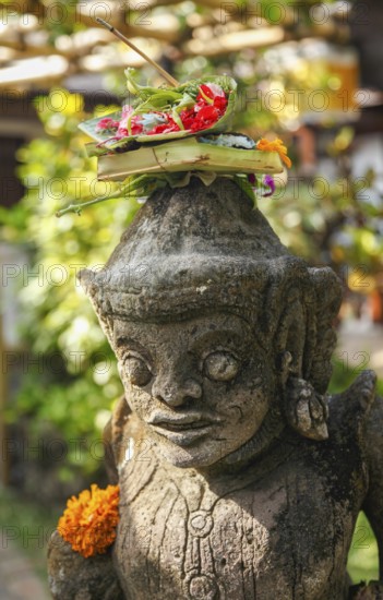 Sacrificial basket (canang) at Tirta Empul hot springs, Bali, Indonesia
