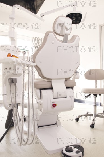 Modern dental clinic with a comfortable chair and equipment for patient care in a bright, clean environment