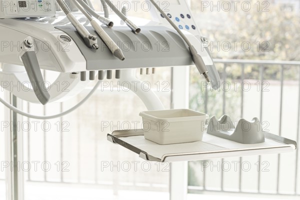 Dental equipment, doctor's unit, module, in a bright clinic, with modern technology, no people, natural light