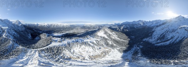 Wonderful winter landscape with Zugspitze, blue sky and snow, mountains and mountain valley, aerial view of Garmisch ski area, Garmisch-Patenkirchen, Bavaria, Germany