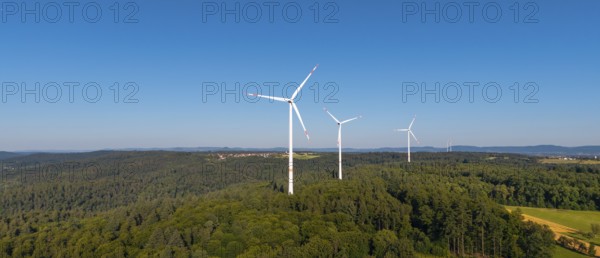 Wind turbines in a green hilly landscape, standing in a clear sky, near Schorndorf, Remstal, Baden-Württemberg, Germany