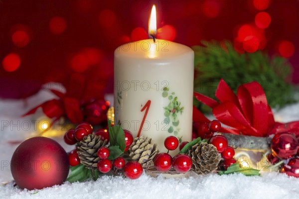 Greetings for the 1st Advent: Advent candle with Christmas decoration
