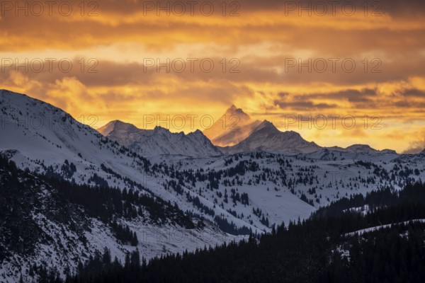 Grossglockner peaks at sunset in winter, spectacular cloudy skies, Hochbrixen, Brixen im Thale, Tyrol, Austria