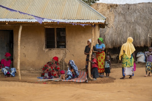 Villagers in a traditional village, mud huts, Sadaani, Tanzania