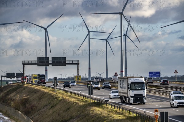 A44 motorway near Bedburg, in front of the Jackerath triangle, recultivated open-cast mining site, Garzweiler open-cast lignite mine, Königshovener Höhe wind farm near Bedburg, operated by RWE and the city of Bedburg, North Rhine-Westphalia, Germany