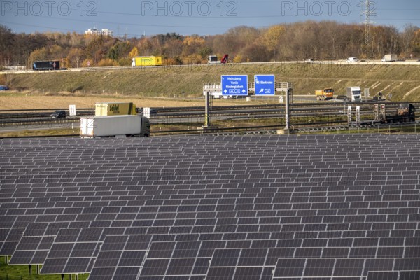 86.5 MW peak open-air photovoltaic systems, from RWE, with over 141, 000 solar modules, on a side strip, along the A44 motorway near Jüchen, at Dreieck Holz, recultivated open-cast mining site, North Rhine-Westphalia, Germany
