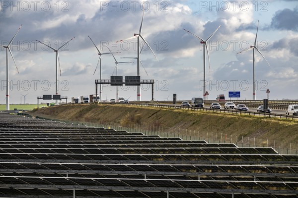 86.5 MW peak open-air photovoltaic systems, from RWE, with over 141, 000 solar modules, on a side strip, along the A44 motorway near Jüchen, at Dreieck Holz, recultivated open-cast mining site, Königshovener Höhe onshore wind farm, operated by RWE and the city of Bedburg, North Rhine-Westphalia, Germany