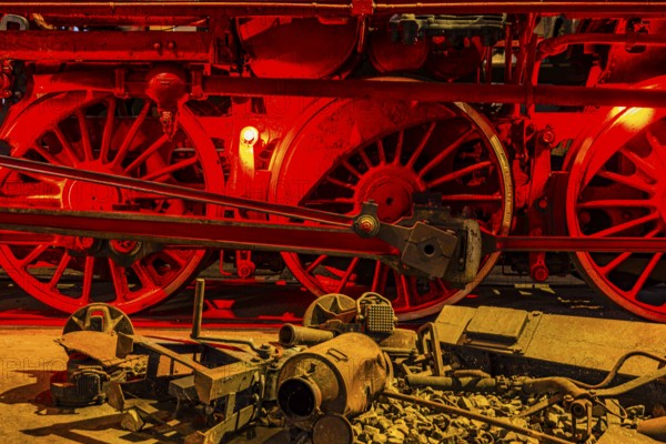 Illuminated wheelwork of a historic locomotive, railway museum, Augsburg railway park, administrative district of Swabia, Bavaria, Germany