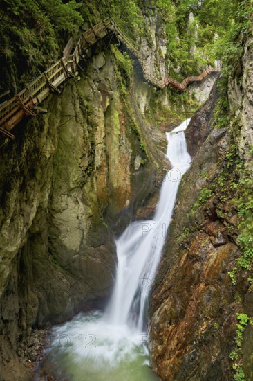 Wooden walkway next to waterfall in the Durnand Gorge, Les Valettes, Canton of Valais, Switzerland