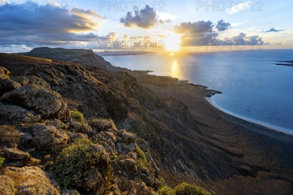 View of steep cliffs on sea and coast, Mirador del Porrito viewpoint at sunset, Lanzarote, Canary Islands, Spain