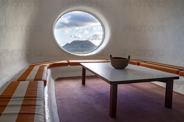 Sitting area with a view of the Volcán de la Corona volcano, interior at the Mirador del Río viewpoint, designed by artist César Manrique, Lanzarote, Canary Islands, Spain