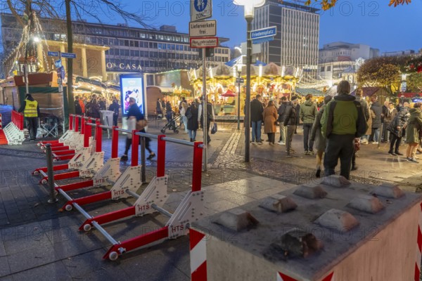 Christmas market in Essen, secured by mobile anti-terrorist lock, modular, movable barrier against car and truck shooting, are opened or closed by a security guard as required, model Herner Truck Lock, HTS, on Kennedyplatz, in Essen, North Rhine-Westphalia, Germany