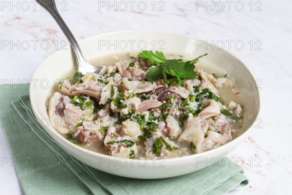 Muzhuzhi, a Georgian dish made from pork legs, with spices and herbs, homemade