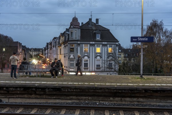 Essen-Steele S-Bahn station, passengers waiting for the train late afternoon, in autumn, Essen, North Rhine-Westphalia, Germany