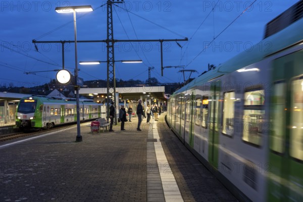 Essen-Steele S-Bahn station, passengers waiting for the train late afternoon, in autumn, Essen, North Rhine-Westphalia, Germany
