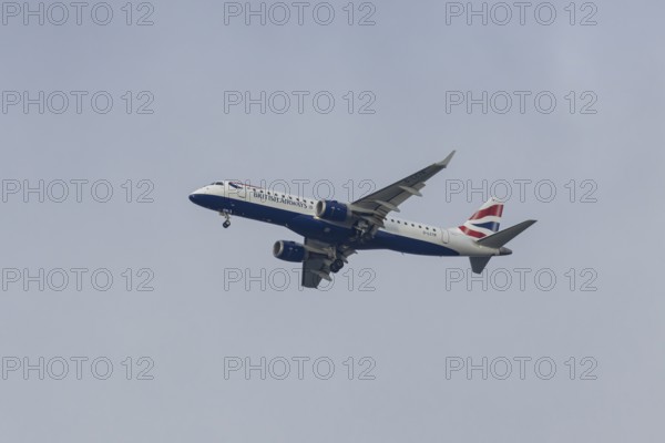 Embraer ERJ-190 jet passenger aircraft of British Airways BA CityFlyer airlines in flight on approach to London city airport, England, United Kingdom