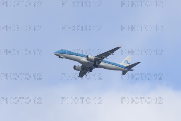 Embraer ERJ-190 jet passenger aircraft of Royal Dutch KLM cityhopper airlines in flight on approach to London city airport, England, United Kingdom